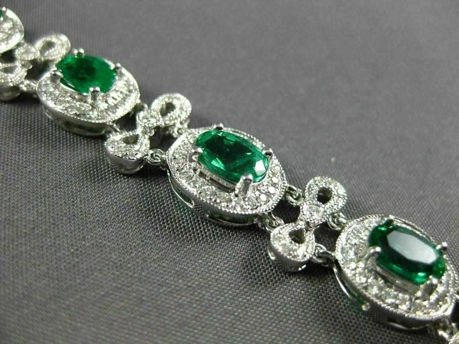 ESTATE WIDE 7.35CT DIAMOND & AAA EMERALD 18KT WHITE GOLD FLOWER TENNIS BRACELET