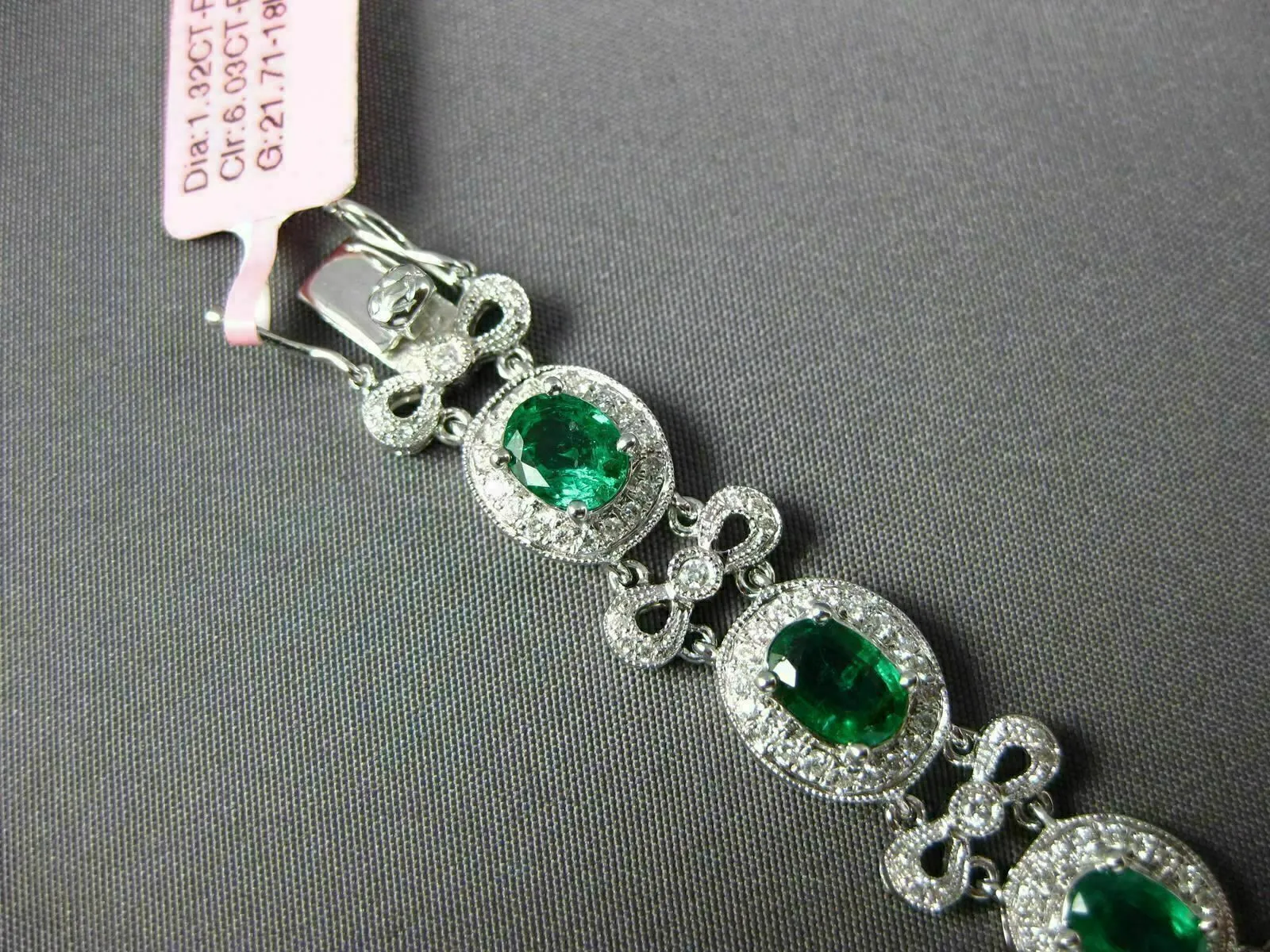 ESTATE WIDE 7.35CT DIAMOND & AAA EMERALD 18KT WHITE GOLD FLOWER TENNIS BRACELET