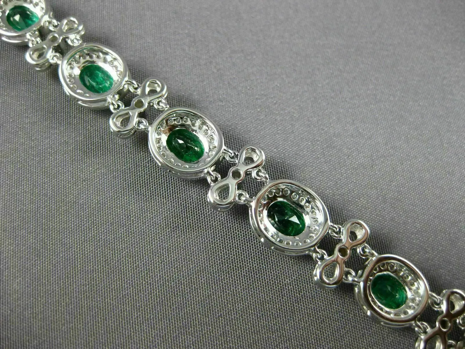 ESTATE WIDE 7.35CT DIAMOND & AAA EMERALD 18KT WHITE GOLD FLOWER TENNIS BRACELET