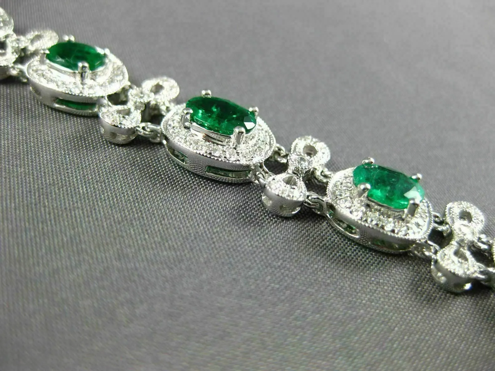 ESTATE WIDE 7.35CT DIAMOND & AAA EMERALD 18KT WHITE GOLD FLOWER TENNIS BRACELET