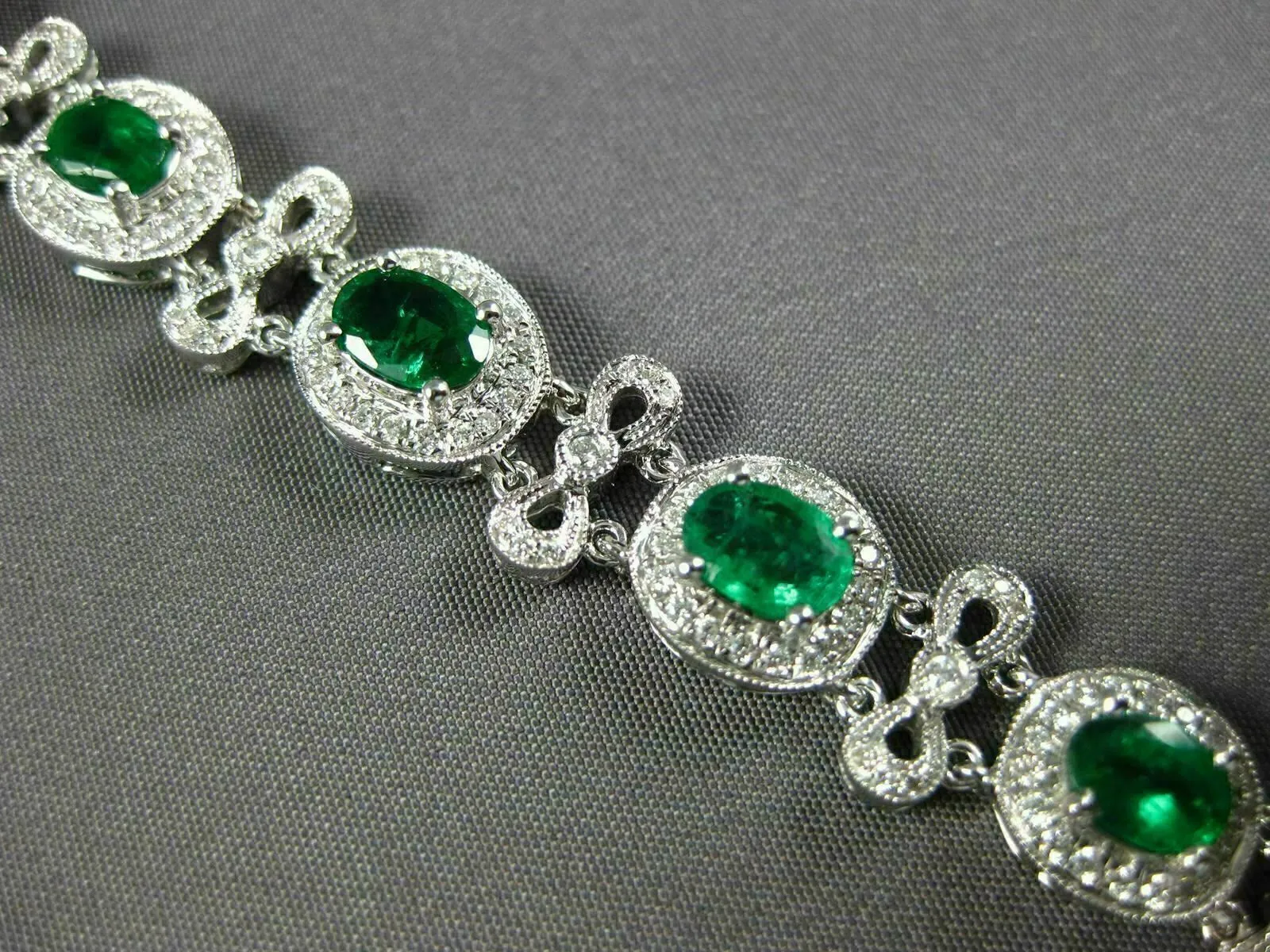 ESTATE WIDE 7.35CT DIAMOND & AAA EMERALD 18KT WHITE GOLD FLOWER TENNIS BRACELET