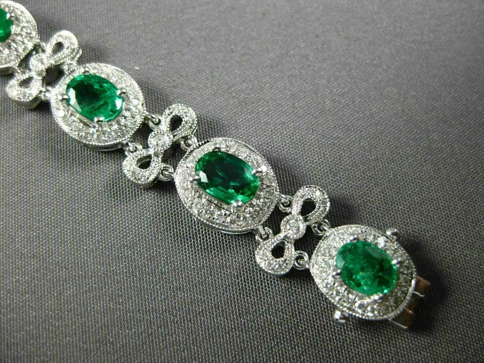 ESTATE WIDE 7.35CT DIAMOND & AAA EMERALD 18KT WHITE GOLD FLOWER TENNIS BRACELET