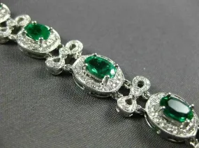 ESTATE WIDE 7.35CT DIAMOND & AAA EMERALD 18KT WHITE GOLD FLOWER TENNIS BRACELET