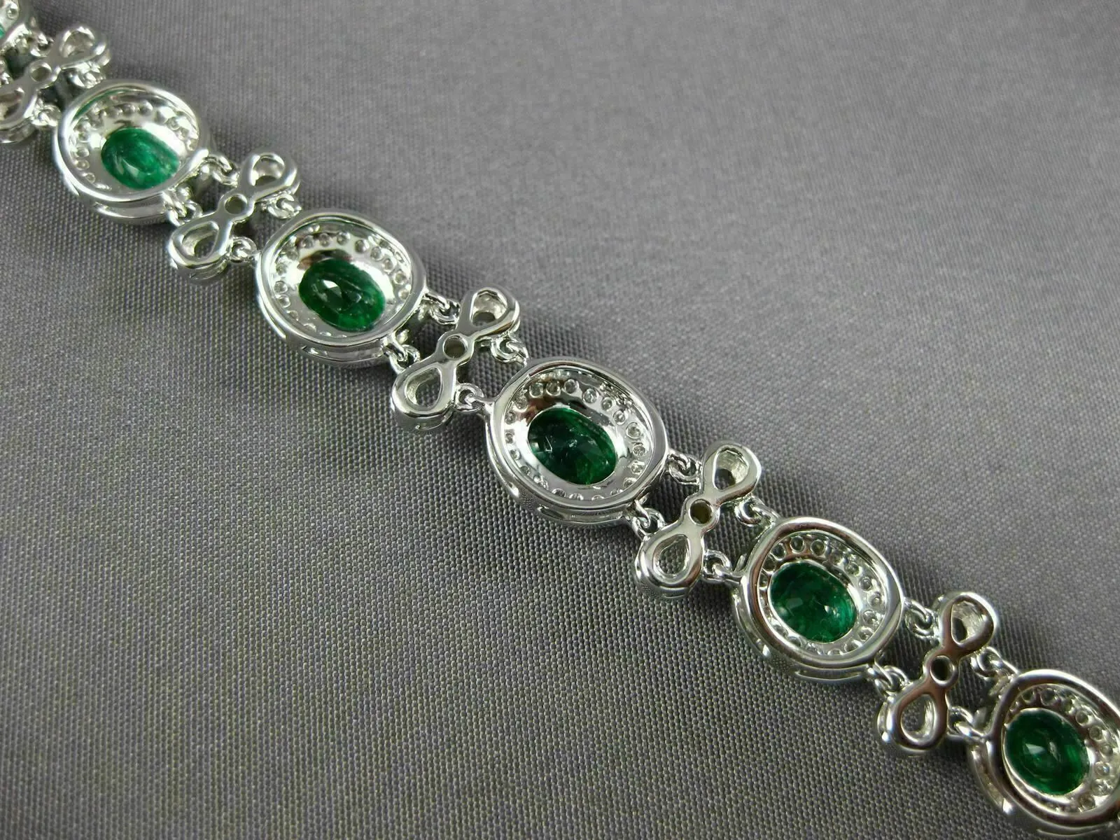 ESTATE WIDE 7.35CT DIAMOND & AAA EMERALD 18KT WHITE GOLD FLOWER TENNIS BRACELET